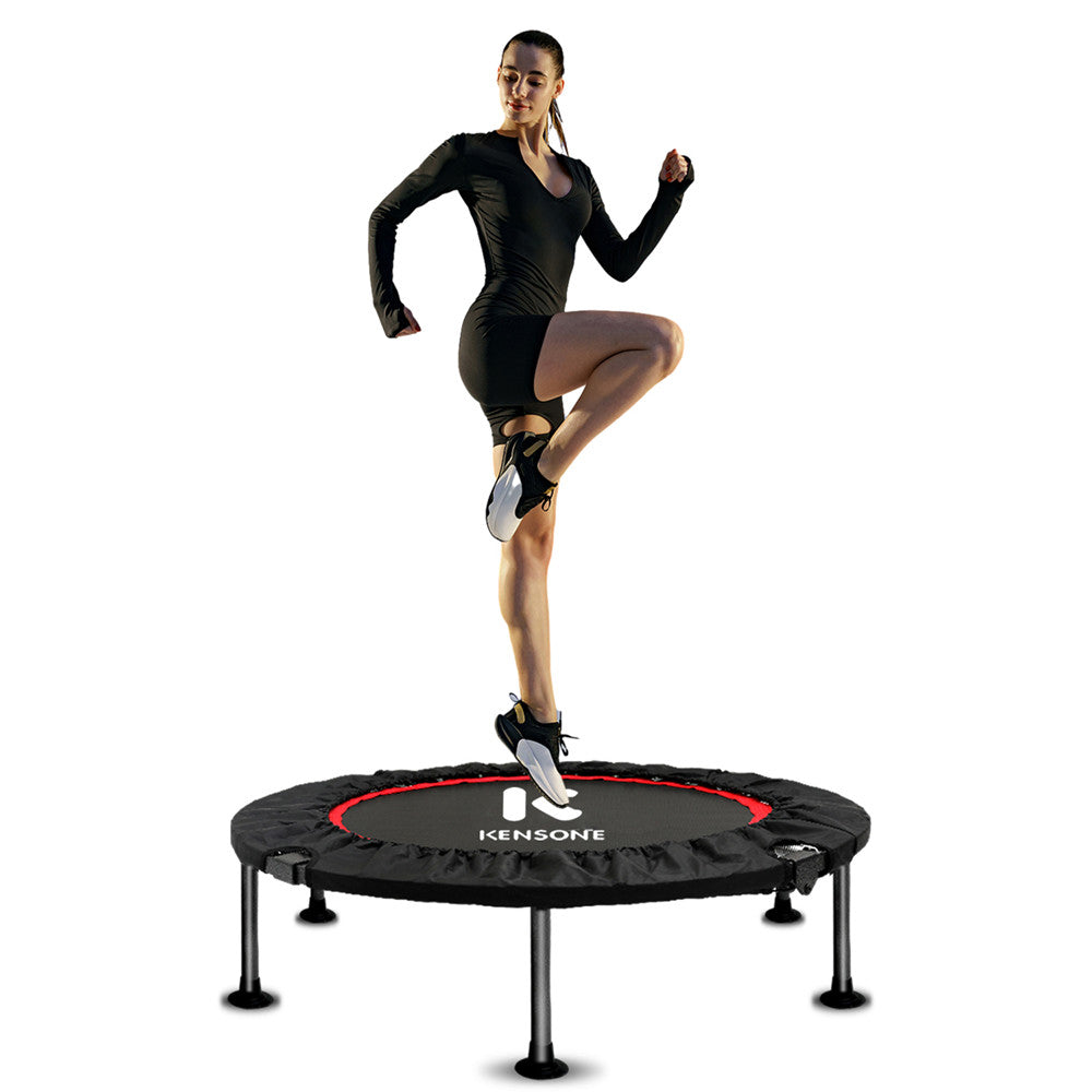 A person exercising on a black and red folding 40-inch fitness trampoline with a visible brand name 'Kensone'.