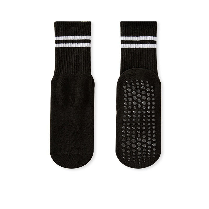 A pair of black no-slip grip tall socks with a striped design on the ankle area and a textured surface for grip.