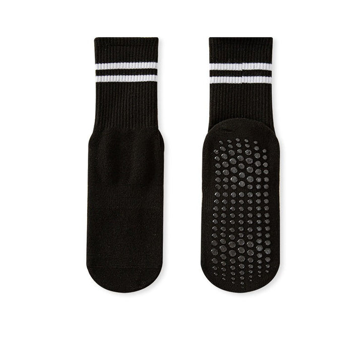 A pair of black no-slip grip tall socks with a striped design on the ankle area and a textured surface for grip.