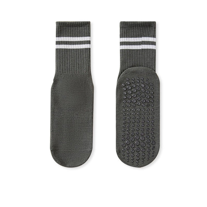 A pair of no-slip grip tall socks with a striped design and textured sole.