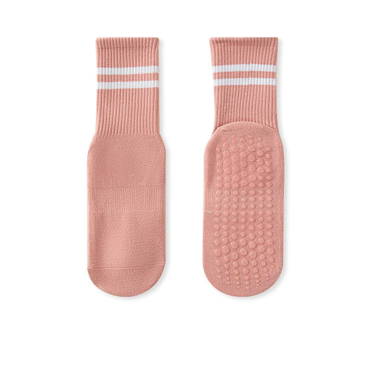 A pair of pink no-slip grip tall socks with non-slip soles, displayed against a white background.