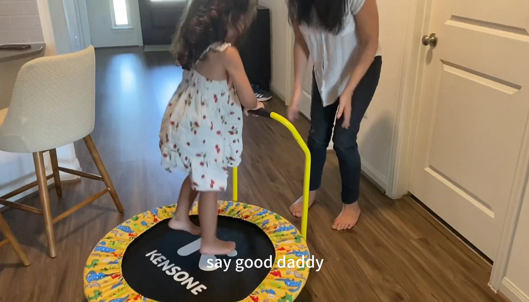 mom-encourages-daughter-to-play-on-trampoline