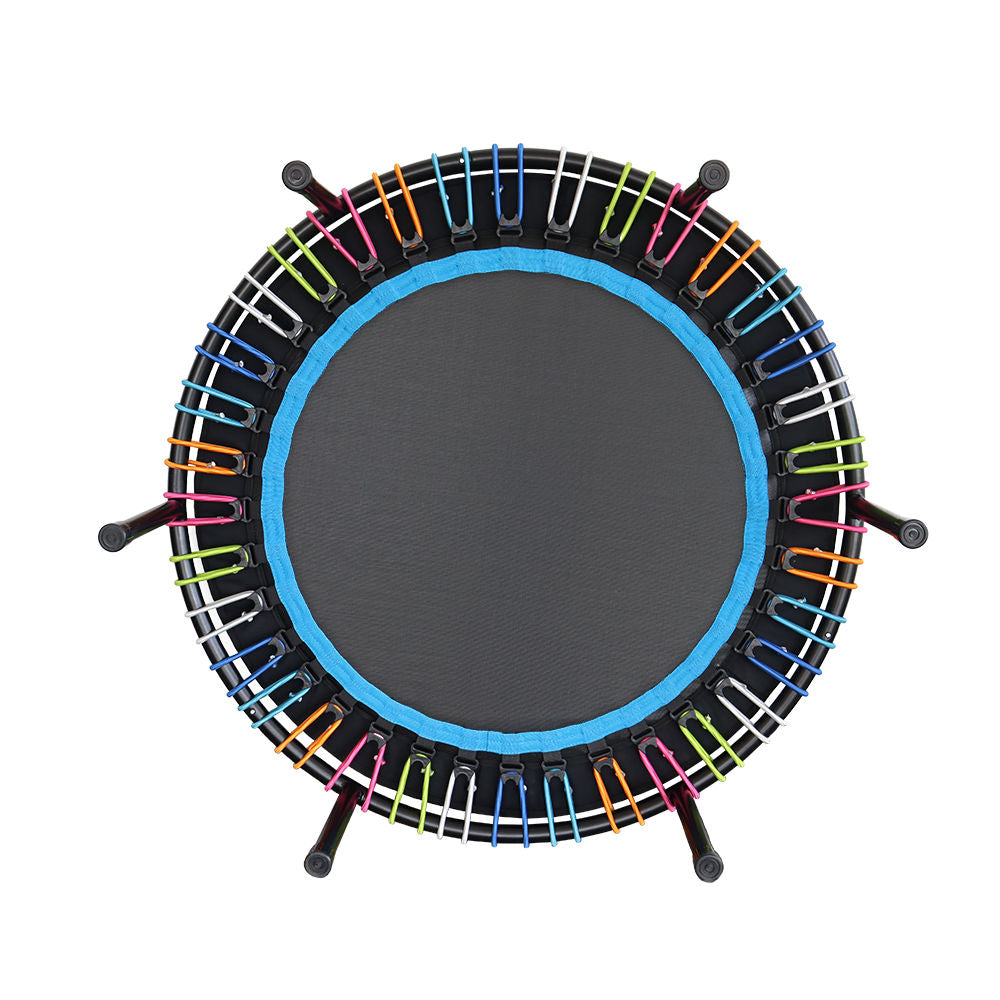 Small trampoline with colorful bungees on a white background