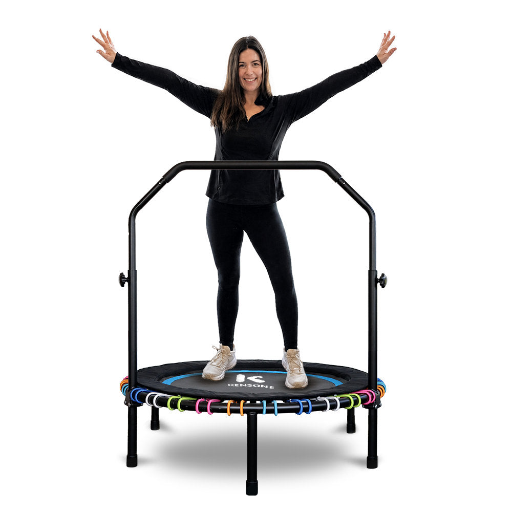 Woman standing on a 44" ProBounce rebounder with arms outstretched against a white background