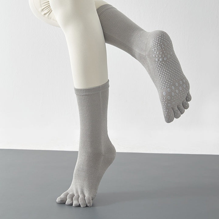 Gray socks with toe separation on a plain background